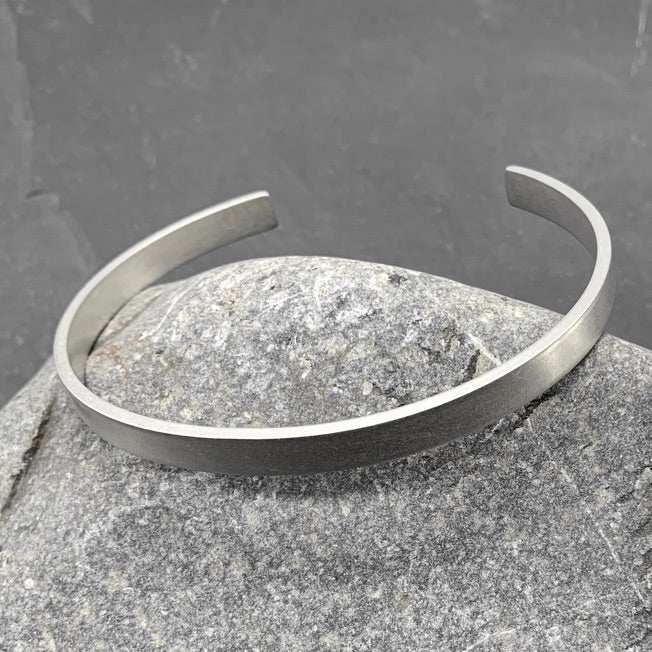 Aventis Plateau Mens Silver Cuff in Satin Finish on Rock