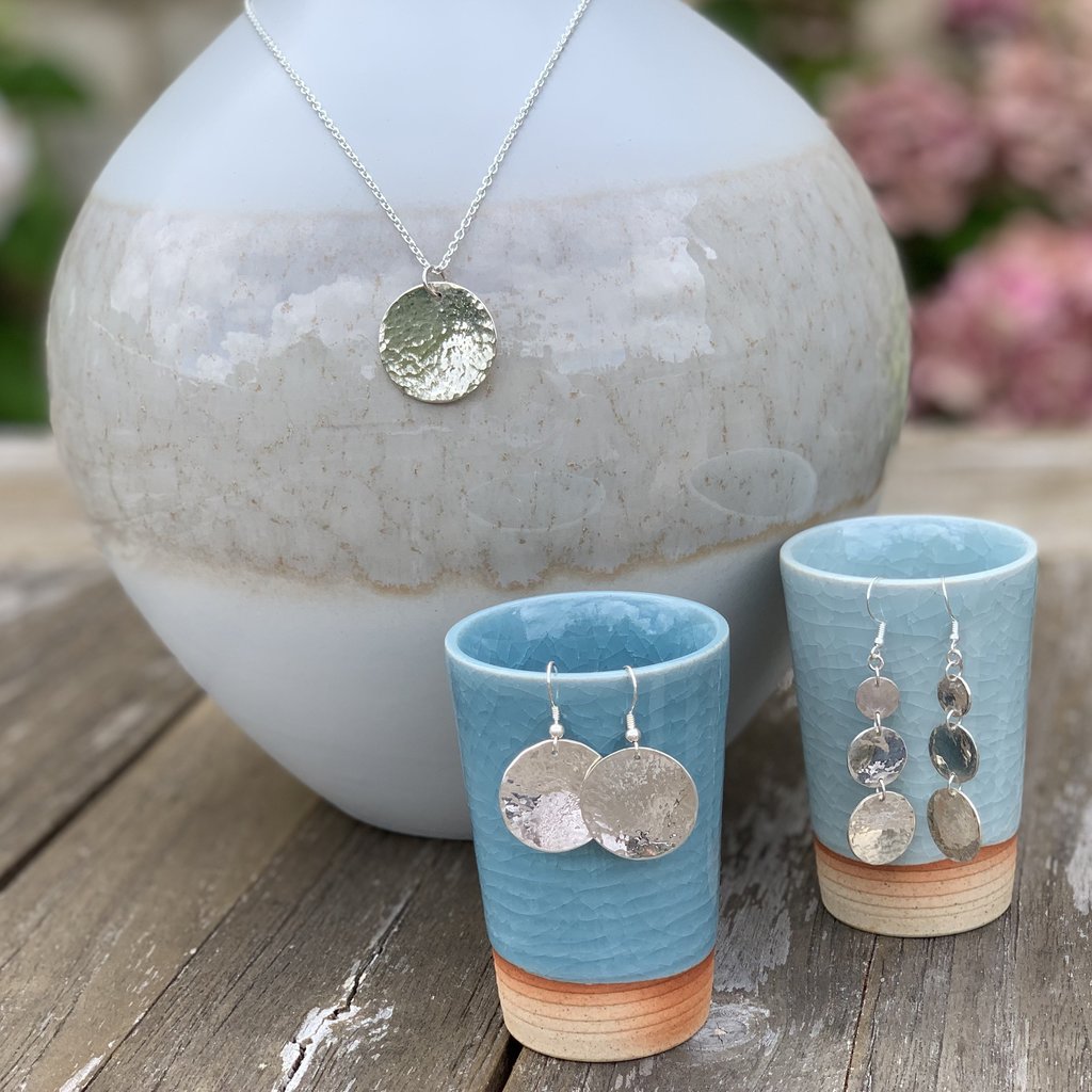 Caldera Lunelle hammered silver pendant with matching sterling silver drop earrings collection