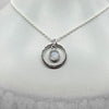 Round cabochon moonstone pendant necklace in silver hammered ring