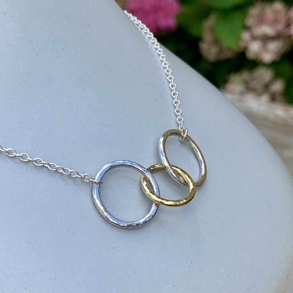 Caldera Tre-Anelli 18 carat gold and silver necklace - close-up