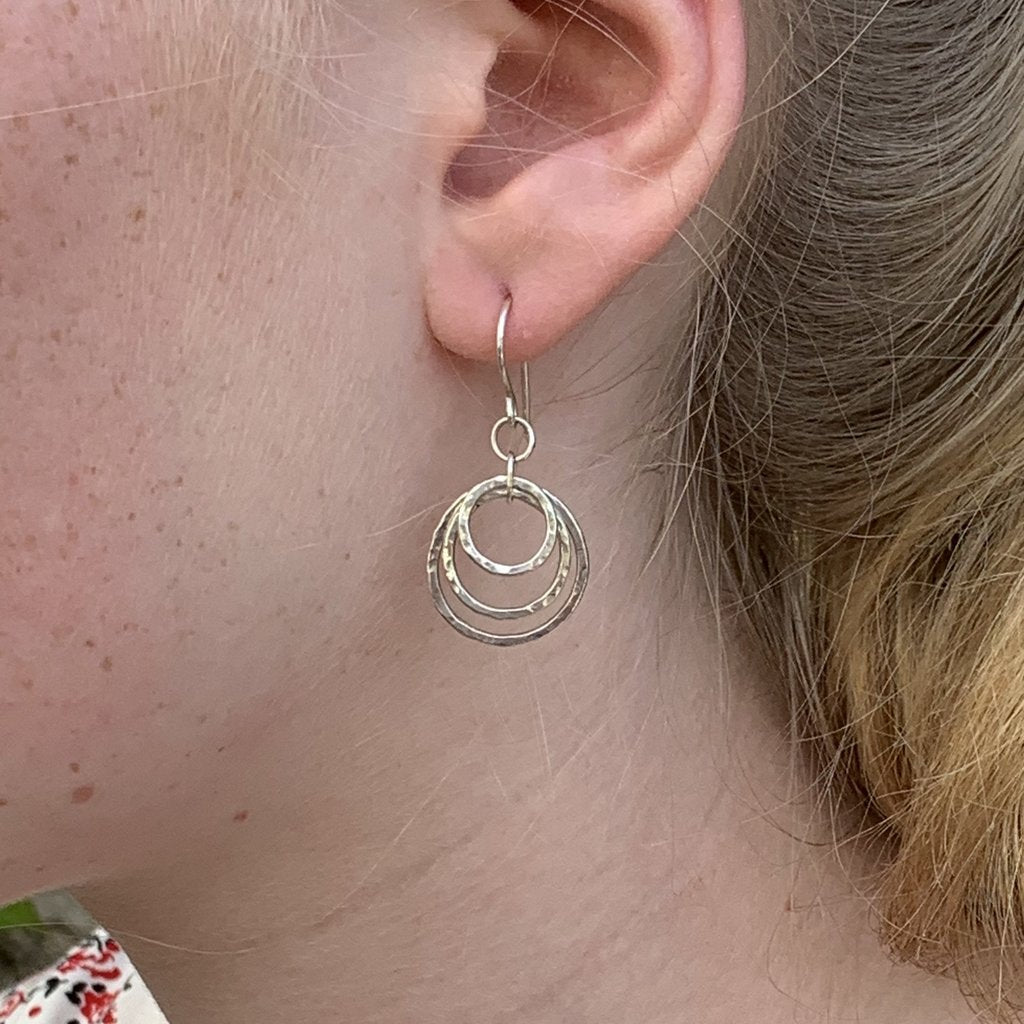 Caldera cirque triplo handmade silver earrings on model