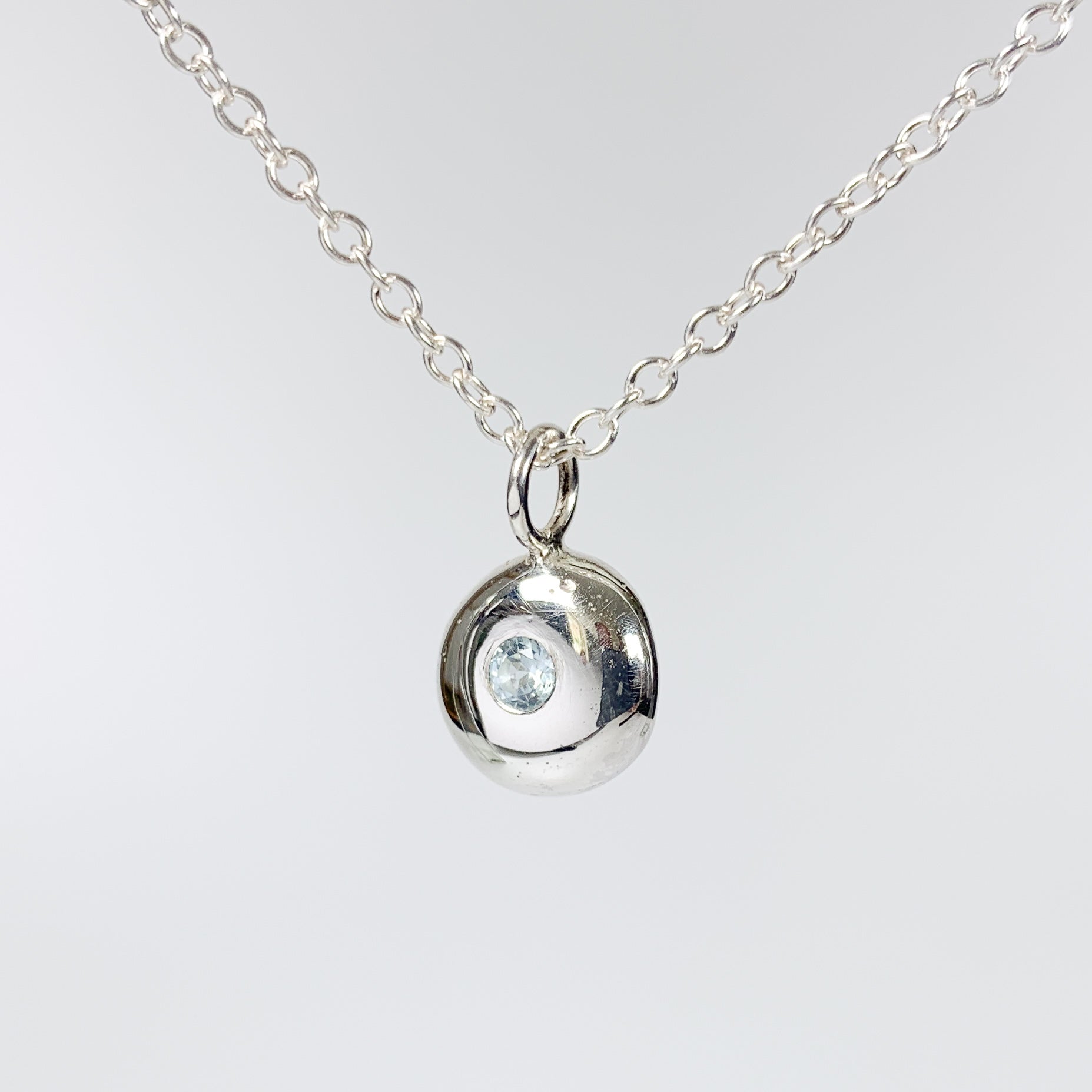 Sterling Silver Pebble Charm Pendant with Sky Blue Topaz
